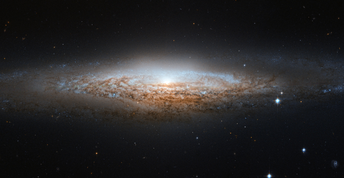 Телескоп Хаббл делает фото спиральной галактики UFO
